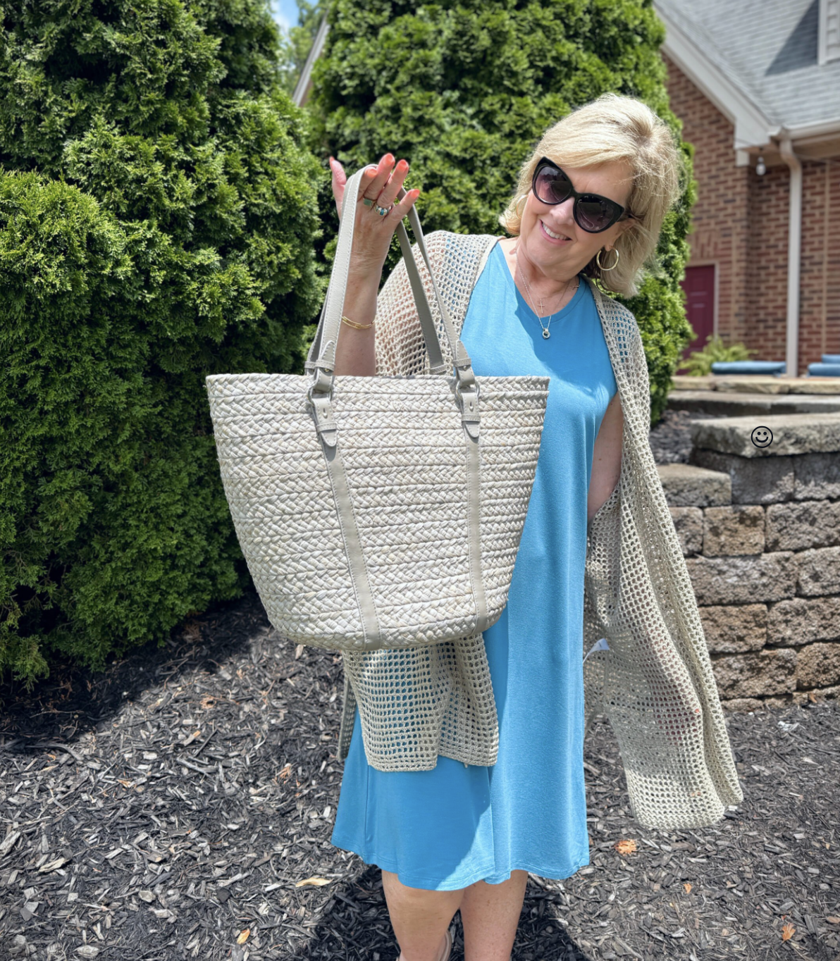 Tania wearing an Eileen Fisher bright blue V-neck dress with a open weave cardigan from Nordstrom Rack